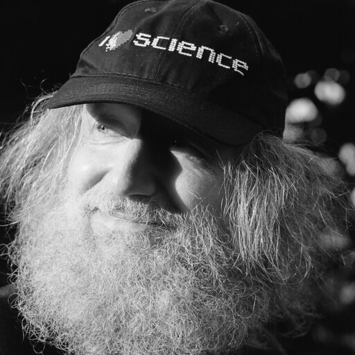 Selective focus photography of person wearing LA Dodgers cap